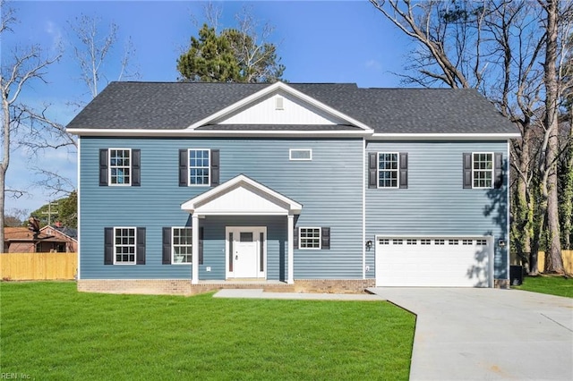 view of front of house with roof with shingles, a front yard, fence, a garage, and driveway