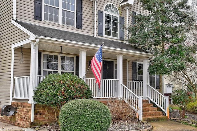 doorway to property featuring a porch