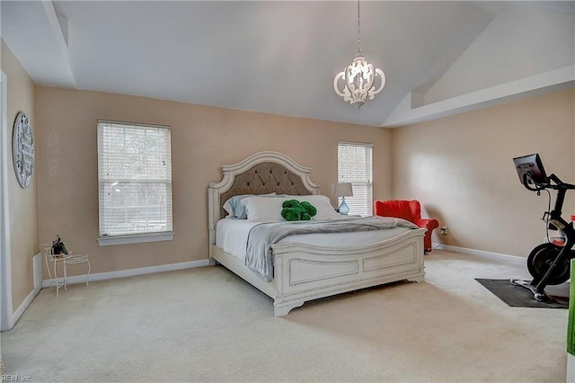 carpeted bedroom with a chandelier, lofted ceiling, and baseboards