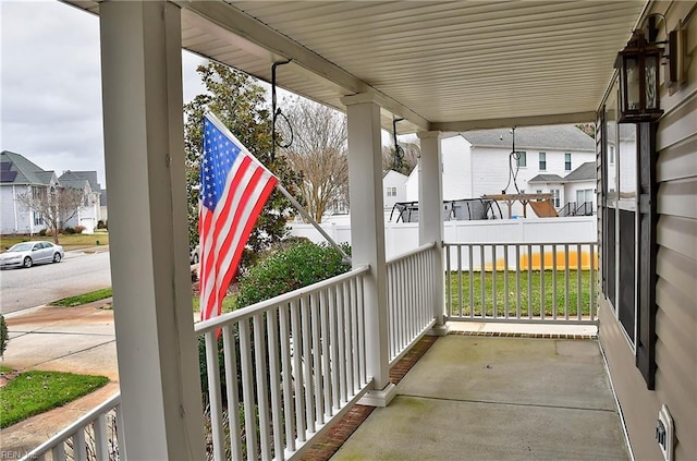 view of patio / terrace featuring covered porch and a residential view