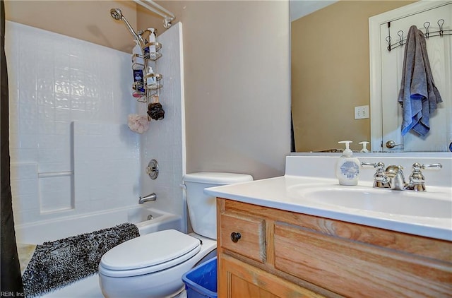 bathroom with shower / washtub combination, vanity, and toilet