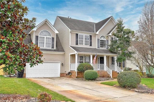 view of front of property with a garage, driveway, a shingled roof, a porch, and a front lawn