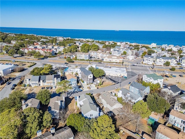 drone / aerial view featuring a water view and a residential view