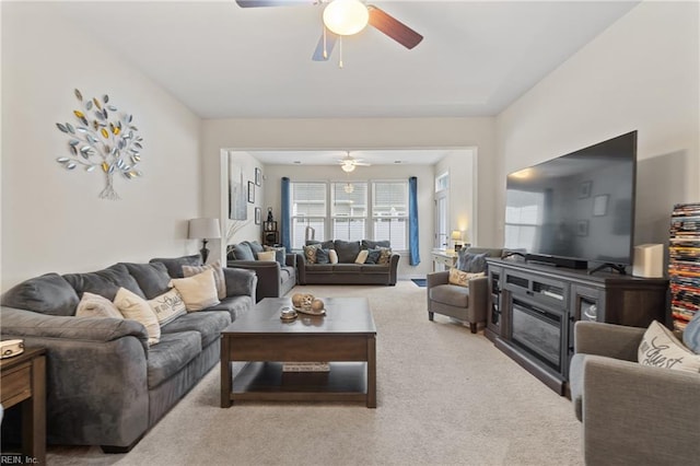 living room with ceiling fan and carpet floors