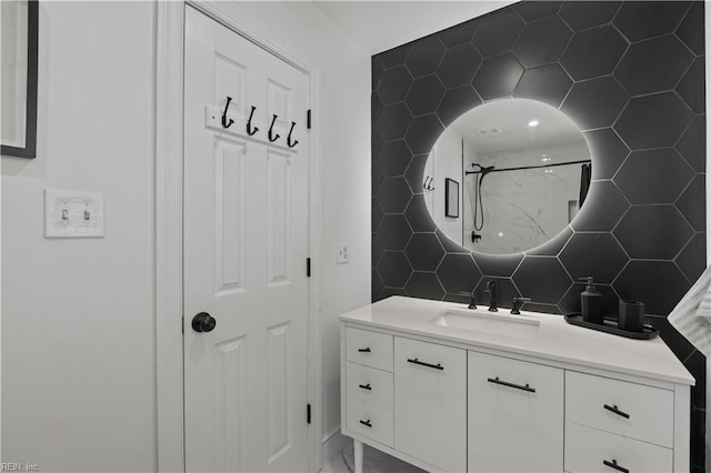 full bath featuring a shower, backsplash, and vanity