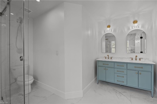 bathroom featuring marble finish floor, a sink, a marble finish shower, and baseboards