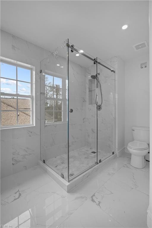 full bathroom with a marble finish shower, visible vents, toilet, marble finish floor, and recessed lighting