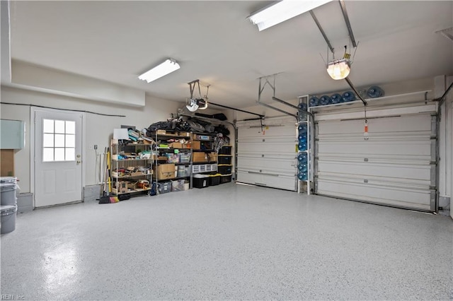 garage featuring a garage door opener