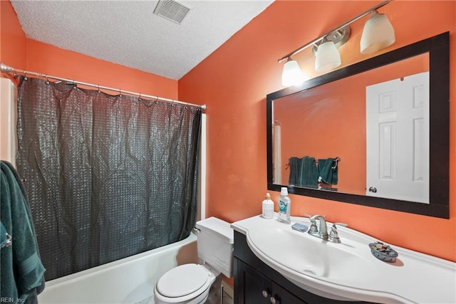 bathroom featuring visible vents, toilet, vanity, shower / bath combination with curtain, and a textured ceiling