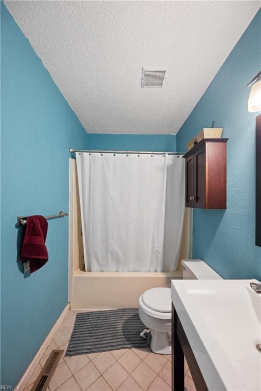 bathroom featuring toilet, tile patterned flooring, visible vents, and shower / tub combo with curtain