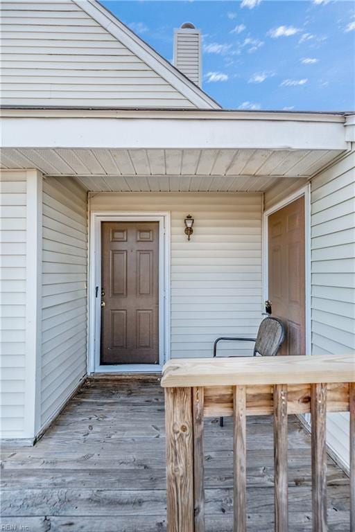 doorway to property featuring a chimney