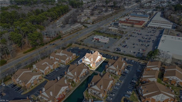 aerial view featuring a water view and a residential view