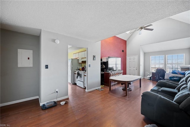 living area featuring electric panel, baseboards, a ceiling fan, dark wood-style floors, and a textured ceiling