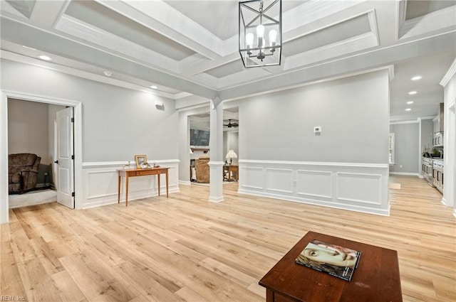 interior space with coffered ceiling, light wood-style floors, beamed ceiling, decorative columns, and crown molding