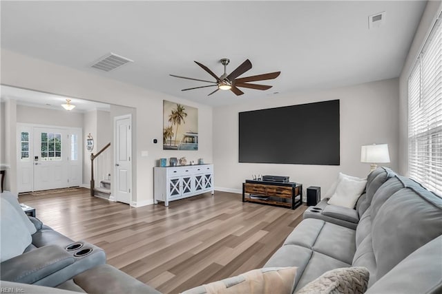 living room with plenty of natural light, wood finished floors, and visible vents