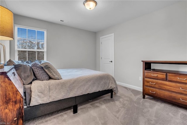 bedroom featuring carpet flooring, visible vents, and baseboards