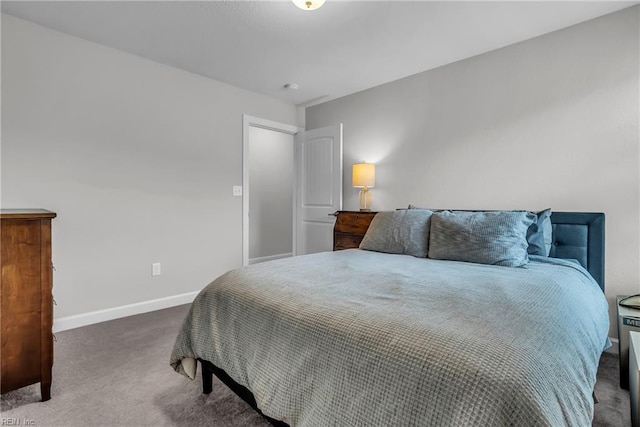 carpeted bedroom featuring baseboards