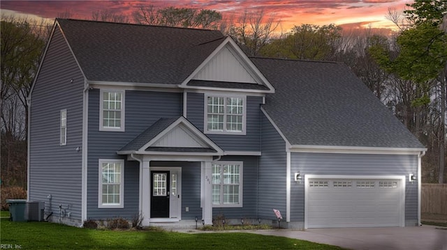 traditional home with concrete driveway, a shingled roof, an attached garage, and cooling unit