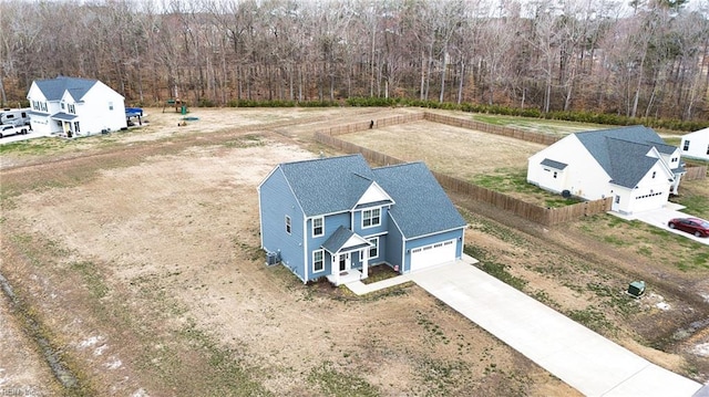 drone / aerial view featuring a view of trees