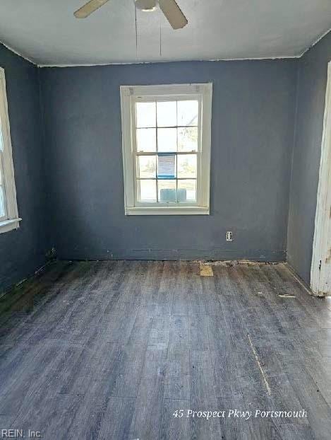 unfurnished room featuring a ceiling fan and wood finished floors