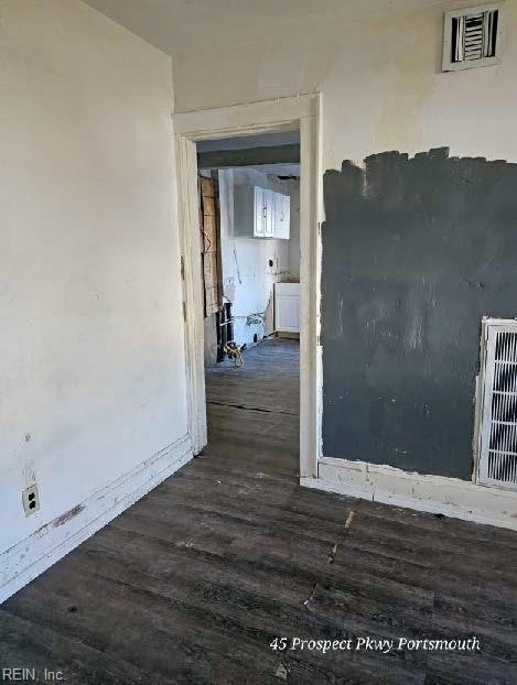 interior space featuring wood finished floors and visible vents