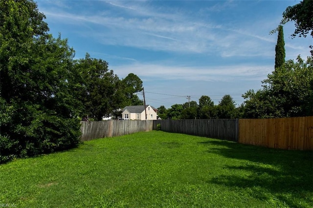 view of yard with a fenced backyard