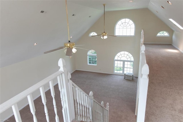 bonus room featuring carpet floors, visible vents, high vaulted ceiling, and a wealth of natural light