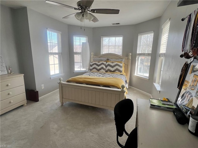 bedroom featuring ceiling fan, carpet, visible vents, and baseboards