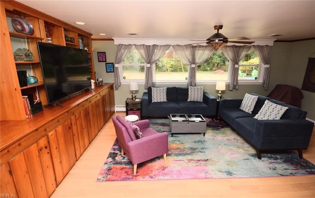 living area with a baseboard radiator, recessed lighting, visible vents, ornamental molding, and ceiling fan