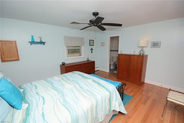 bedroom with light wood-style floors, ceiling fan, baseboards, and ensuite bathroom