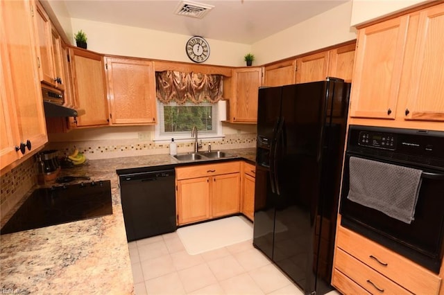 kitchen with visible vents, decorative backsplash, a sink, black appliances, and extractor fan