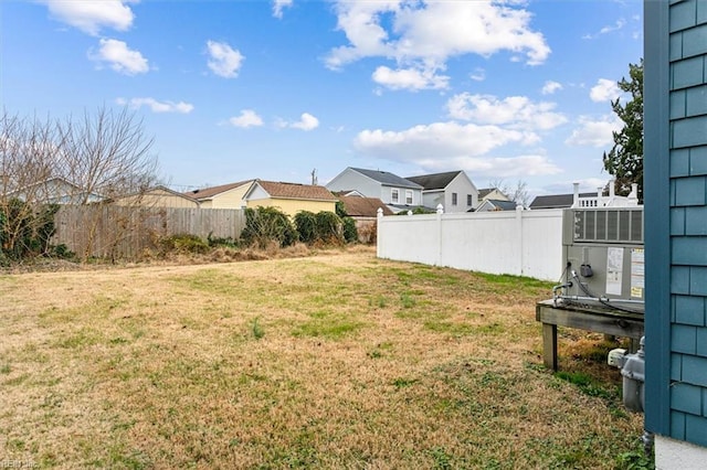 view of yard featuring a residential view and fence