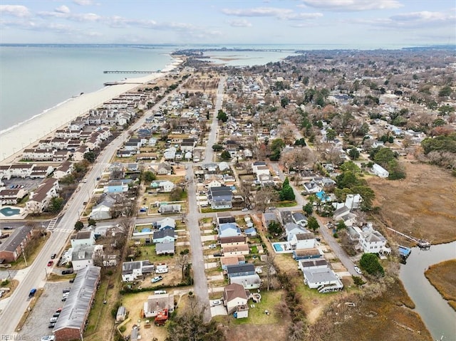 drone / aerial view featuring a water view and a residential view