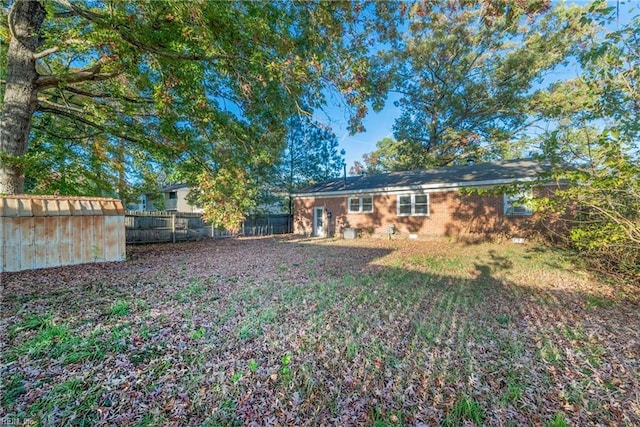 back of house featuring a fenced backyard