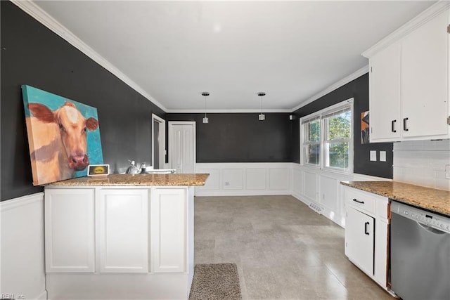 kitchen with stainless steel dishwasher, wainscoting, and white cabinets