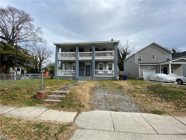 view of front of house featuring a balcony, covered porch, and fence