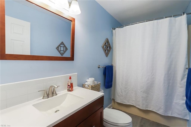 full bathroom featuring vanity and toilet