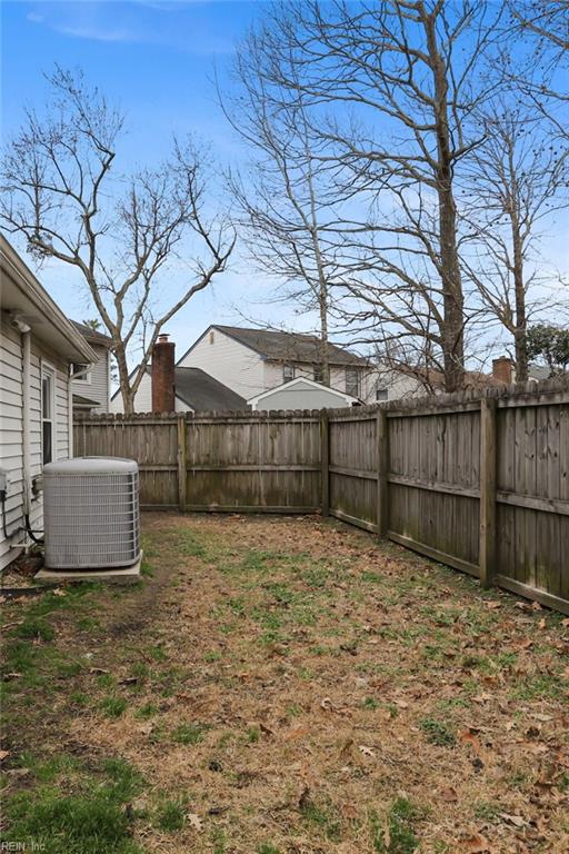 view of yard featuring a fenced backyard and cooling unit