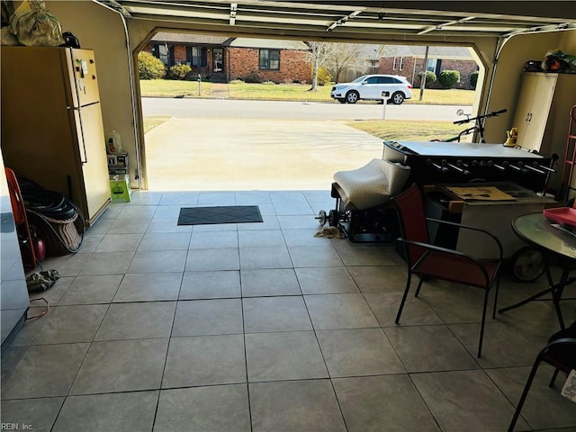 garage with freestanding refrigerator