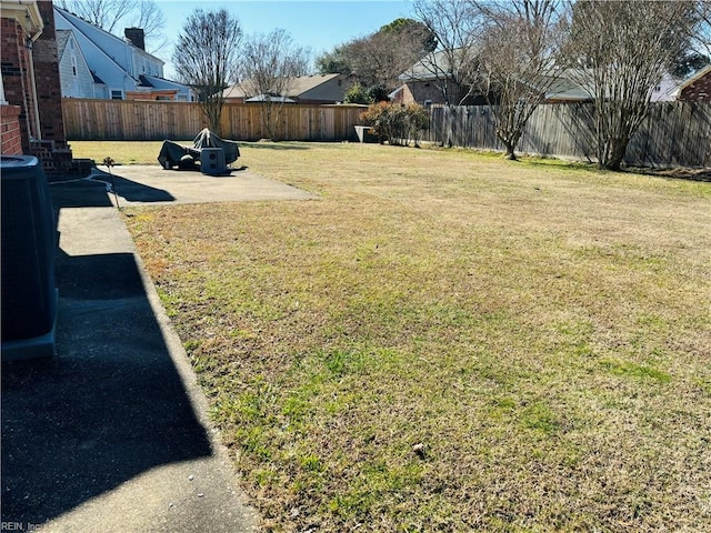 view of yard with a fenced backyard and a patio