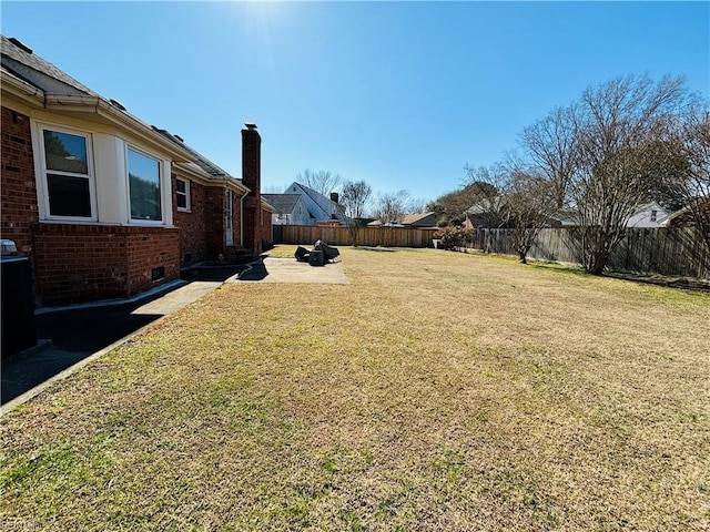 view of yard featuring a fenced backyard and a patio