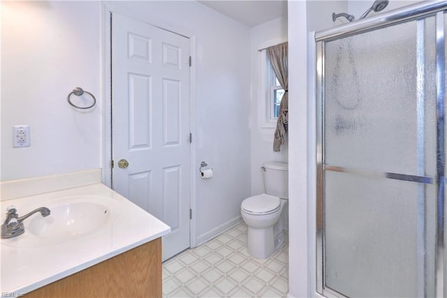 full bath with a stall shower, baseboards, toilet, tile patterned floors, and vanity