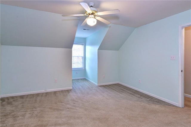 additional living space with carpet floors, baseboards, and visible vents