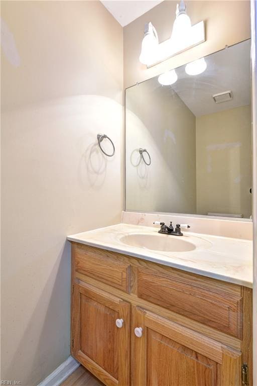 bathroom featuring visible vents and vanity