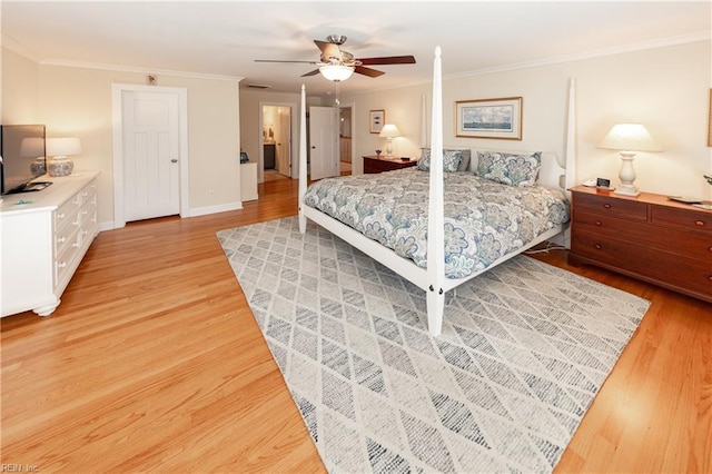 bedroom with baseboards, light wood finished floors, a ceiling fan, and crown molding