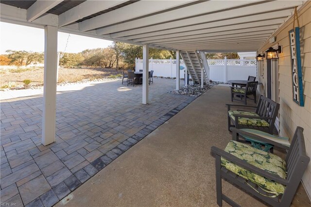 view of patio / terrace with outdoor dining area and fence