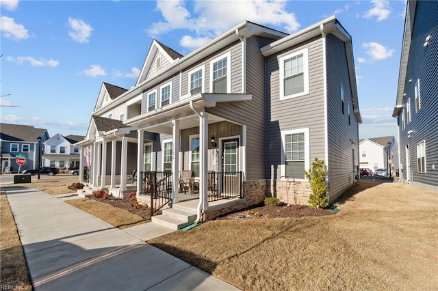 view of front of house with a residential view and covered porch