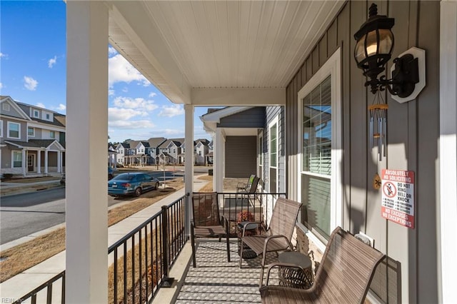 balcony with a residential view and covered porch