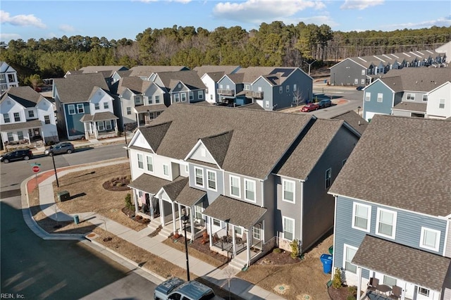 birds eye view of property with a residential view