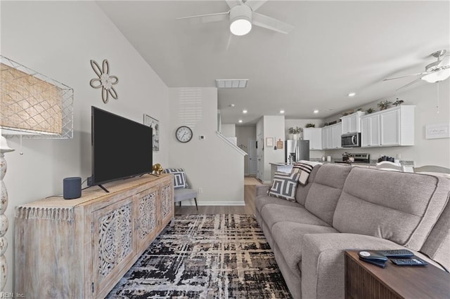 living area featuring light wood finished floors, recessed lighting, visible vents, and a ceiling fan